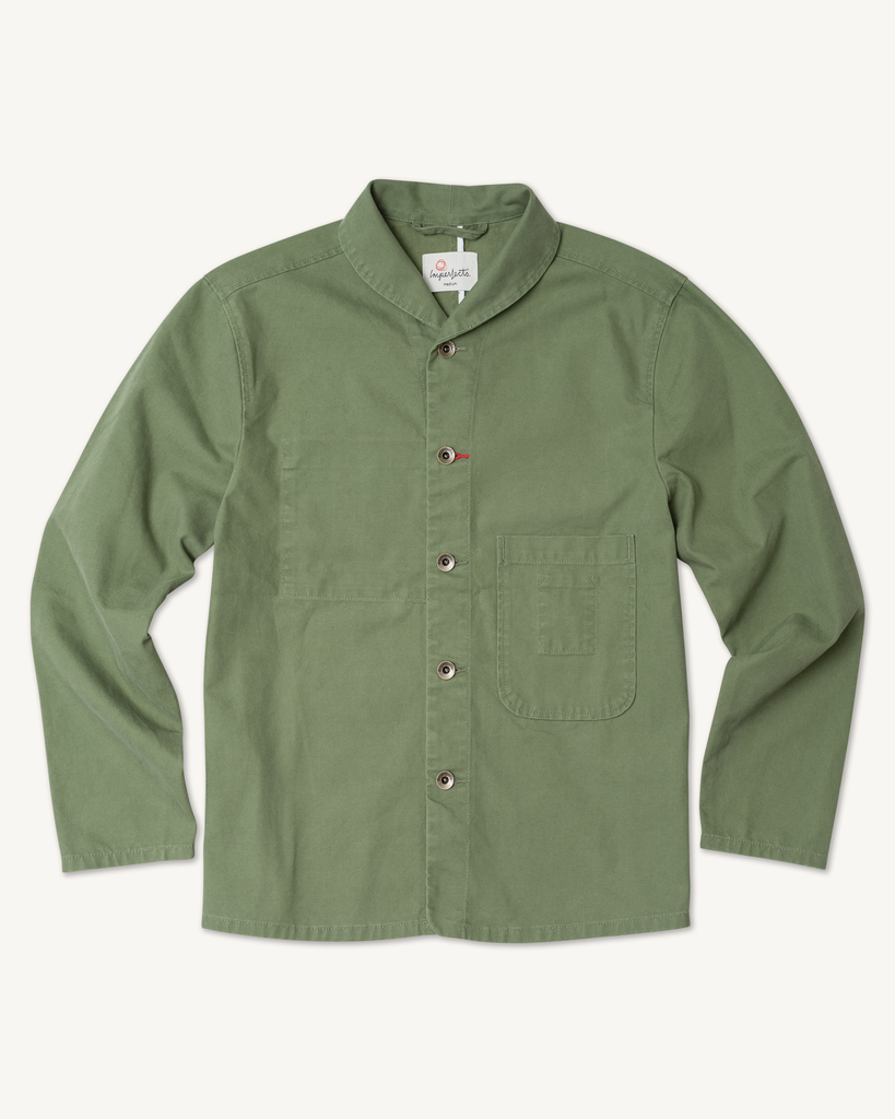 Flat lay of men’s Shepherd’s Shirt in Olive, with durable organic cotton canvas, mismatched buttons, a front chest pocket, and a clean, structured fit.