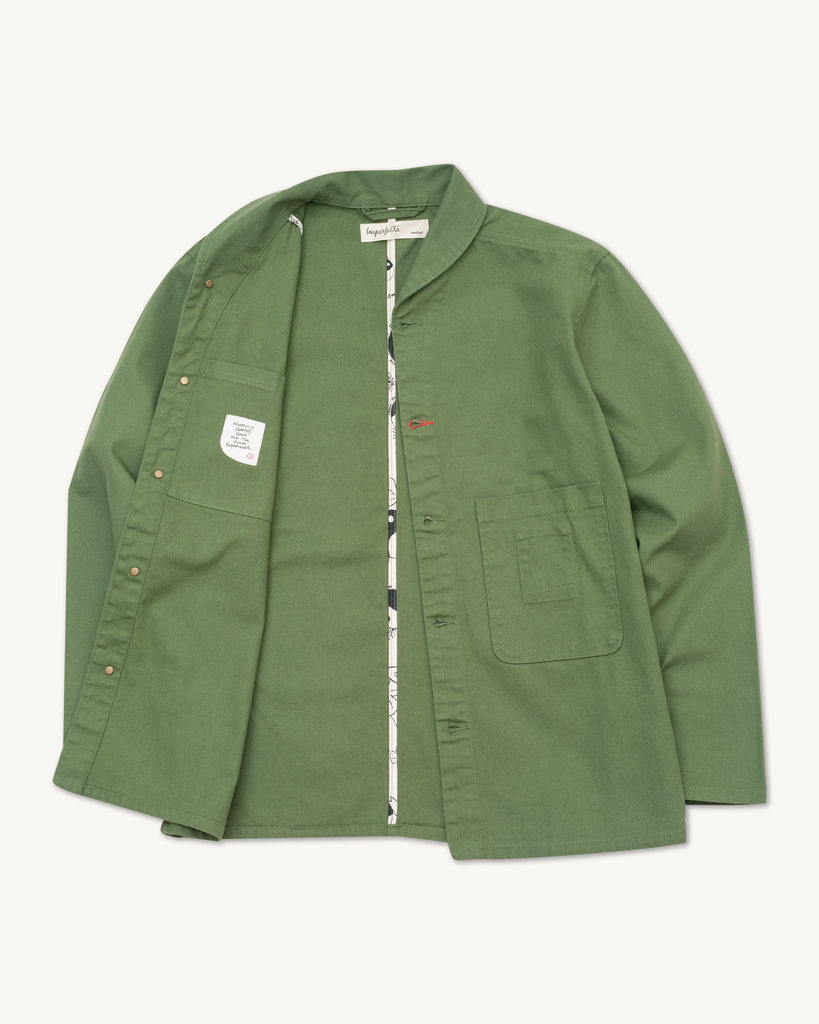 The Shepherds Shirt is a silhouette born of the joining of a family favorite vintage Kimono and a 1920’s French field shirt. This piece has a Kimono style lip collar, French split side seams, and Corozo Buttons. It is finished with a heavy stone wash for effect and comfort and has a refined crop in the sleeves so you can be sure to easily check your timepiece.

Detail

9.2oz, 100% Organic Cotton Canvas
Durable Brass Tack Buttons
Triple Pocketing - One &nbsp;Internal Drop-In Pocket, One External w/ Hidden Co