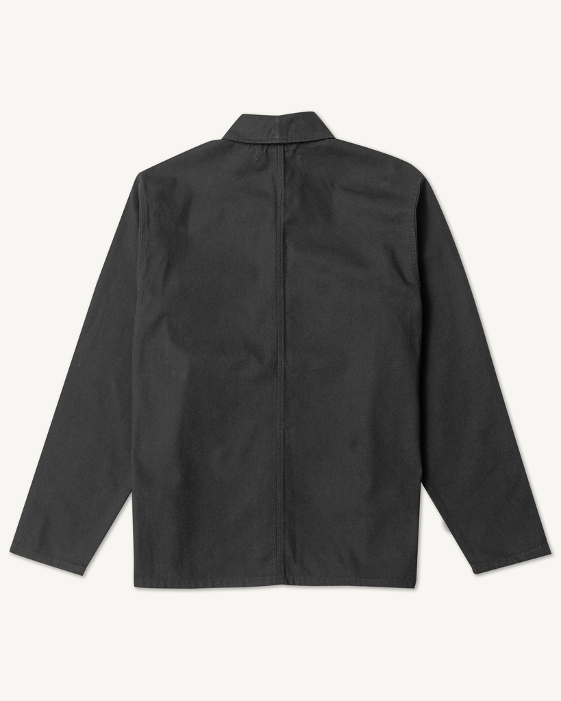 The Shepherds Shirt is a silhouette born of the joining of a family favorite vintage Kimono and a 1920’s French field shirt. This piece has a Kimono style lip collar, French split side seams, and Corozo Buttons. It is finished with a heavy stone wash for effect and comfort and has a refined crop in the sleeves so you can be sure to easily check your timepiece.

Detail

9.2oz, 100% Organic Cotton Canvas
Durable Brass Tack Buttons
Triple Pocketing - One &nbsp;Internal Drop-In Pocket, One External w/ Hidden Co