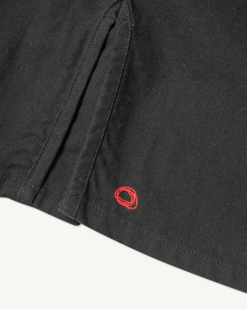 The Shepherds Shirt is a silhouette born of the joining of a family favorite vintage Kimono and a 1920’s French field shirt. This piece has a Kimono style lip collar, French split side seams, and Corozo Buttons. It is finished with a heavy stone wash for effect and comfort and has a refined crop in the sleeves so you can be sure to easily check your timepiece.

Detail

9.2oz, 100% Organic Cotton Canvas
Durable Brass Tack Buttons
Triple Pocketing - One &nbsp;Internal Drop-In Pocket, One External w/ Hidden Co