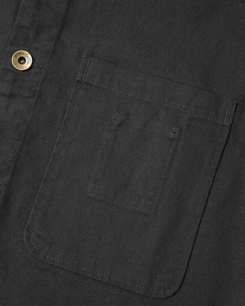 The Shepherds Shirt is a silhouette born of the joining of a family favorite vintage Kimono and a 1920’s French field shirt. This piece has a Kimono style lip collar, French split side seams, and Corozo Buttons. It is finished with a heavy stone wash for effect and comfort and has a refined crop in the sleeves so you can be sure to easily check your timepiece.

Detail

9.2oz, 100% Organic Cotton Canvas
Durable Brass Tack Buttons
Triple Pocketing - One &nbsp;Internal Drop-In Pocket, One External w/ Hidden Co